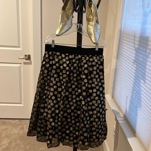 Black shirt with gold shimmery circled